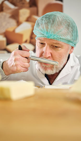 Man smelling cheese