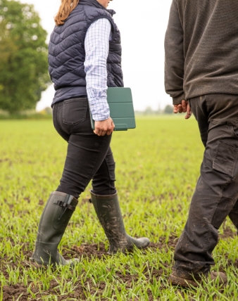 Farmers walking in a field